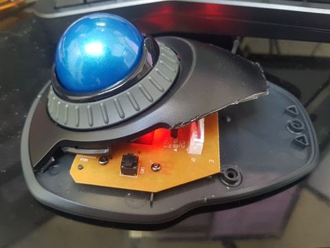 Just as it was intended to be used An actual photo of my trackball mouse with a badly sawn-off cover